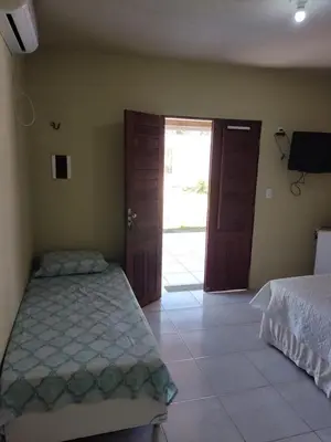 Uma cama ou camas num quarto em Flecheiras- Davitória