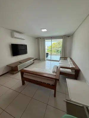 Uma televisão e/ou sistema de entretenimento em Apartamento Catú lake