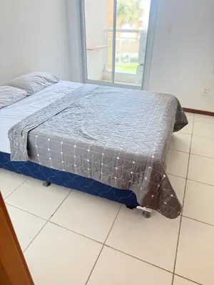 Uma cama ou camas num quarto em Apartamento Catú lake