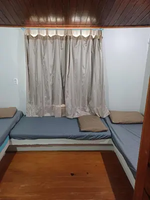 Uma cama ou camas num quarto em Chalé Icaraí
