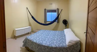Uma cama ou camas num quarto em Nova casa de praia na Caponga