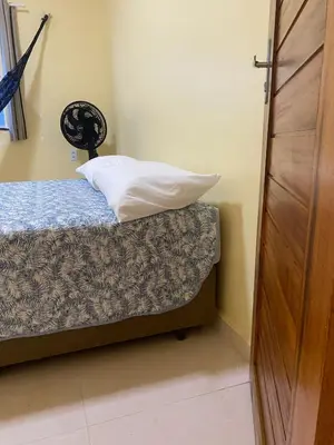 Uma cama ou camas num quarto em Nova casa de praia na Caponga