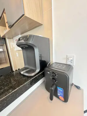 A cozinha ou kitchenette de AP completo próx ao Shopping com piscina, garagem e ar