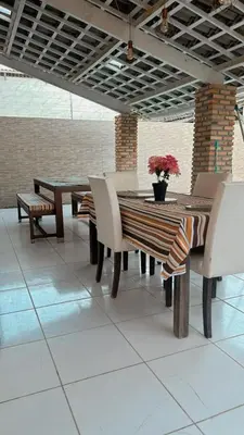 Uma área de estar em Cris hospedagem