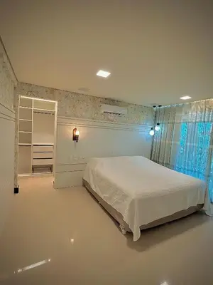 Uma cama ou camas num quarto em Bangalô Duplex Exclusivo em Manhattan Riviera