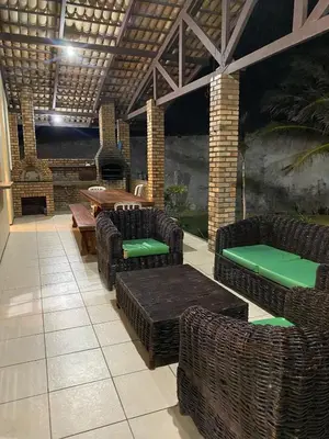 Uma área de estar em Casa de praia - águas belas