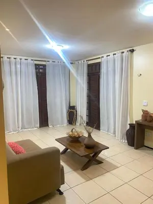 Uma área de estar em Casa de praia - águas belas