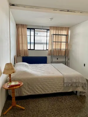 Uma cama ou camas num quarto em Quarto no bairro Meireles à 50m da Beira-Mar