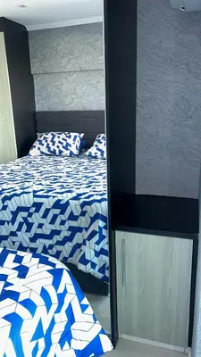 Uma cama ou camas num quarto em studio de iracema