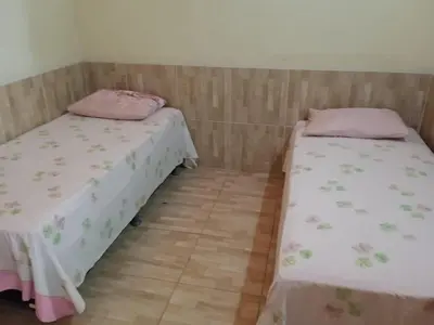 Uma cama ou camas num quarto em Condominio Nina2