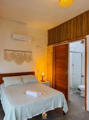 Uma cama ou camas num quarto em Moitas Chalés