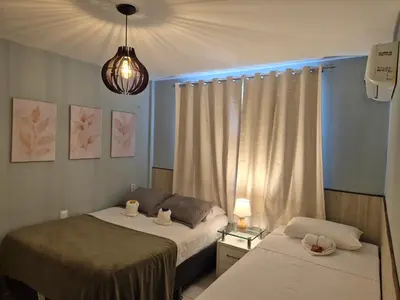 Uma cama ou camas num quarto em TerraMaris - Vista Mar - Térreo - Pé na Areia