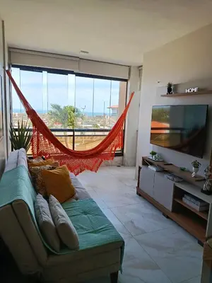 Uma televisão e/ou sistema de entretenimento em Apartamento no Porto das Dunas
