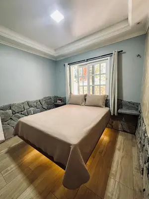 Uma cama ou camas num quarto em Villa Suíça Guaramiranga