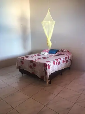 Uma cama ou camas num quarto em Recanto Beach casa de Temporada