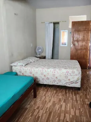 Uma cama ou camas num quarto em Apartamento aconchegante Cumbuco
