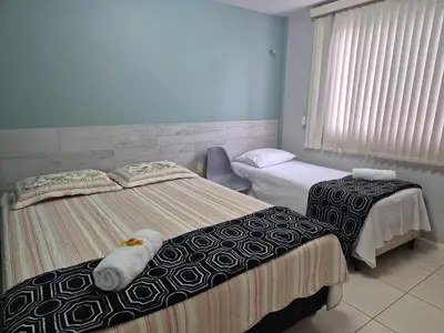 Uma cama ou camas num quarto em TerraMaris - Pé na Areia e Vista Mar Deslumbrante