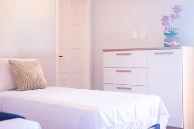 Uma cama ou camas num quarto em Casa Refúgio Tropical