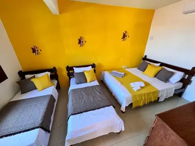 Uma cama ou camas num quarto em Splendide villa à morro branco vue sur mer