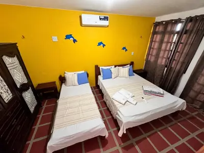 Uma cama ou camas num quarto em Splendide villa à morro branco vue sur mer