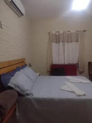 Uma cama ou camas num quarto em Casa de temporada paraíso jeri