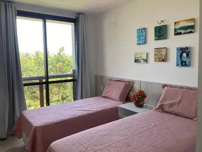 Uma cama ou camas num quarto em Apartamento no WaiWai Cumbuco