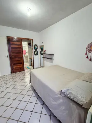Uma cama ou camas num quarto em Porto Canoa Residence