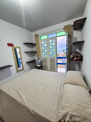 Uma cama ou camas num quarto em Porto Canoa Residence