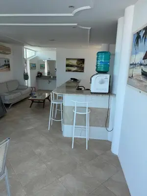 Uma televisão e/ou sistema de entretenimento em Luxury Mansion in Porto das Dunas
