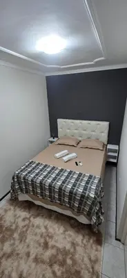 Uma cama ou camas num quarto em Tesouro da Maraponga