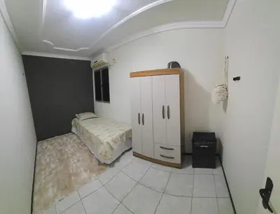 Uma cama ou camas num quarto em Tesouro da Maraponga