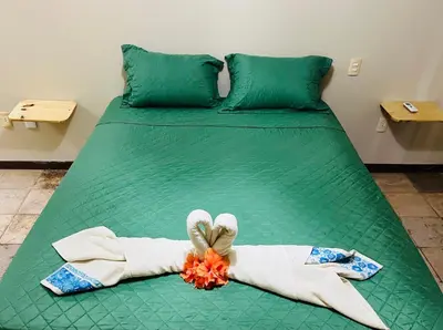 Uma cama ou camas num quarto em Kite Bistro