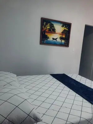 Uma cama ou camas num quarto em Chalé Casa Moitas
