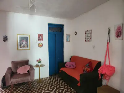 Uma área de estar em Quarto em casa aconchegante no Benfica