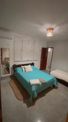 Uma cama ou camas num quarto em Casa do Kite