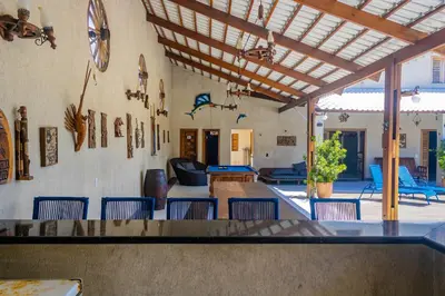Uma área de estar em Belíssima casa na praia do Morro Branco