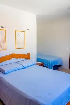 Uma cama ou camas num quarto em Belíssima casa na praia do Morro Branco