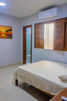 Uma cama ou camas num quarto em Belíssima casa na praia do Morro Branco