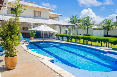 A piscina em ou perto de Belíssima casa na praia do Morro Branco