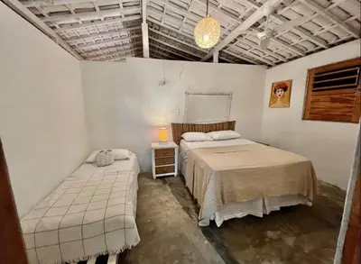 Uma cama ou camas num quarto em Casa Sereia Icapuí
