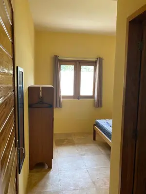 Uma cama ou camas num quarto em Paraíso na praia