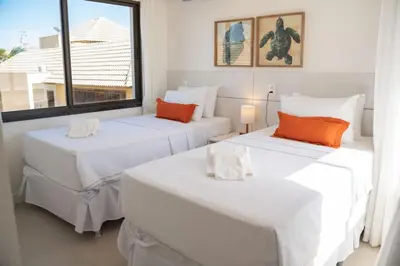 Uma cama ou camas num quarto em The Coral Beach Resort