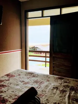 Uma cama ou camas num quarto em Ondas do mar Taiba Residence
