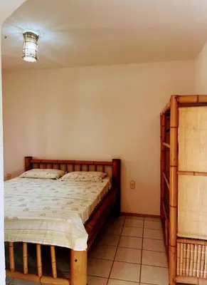 Uma cama ou camas num quarto em Ondas do mar Taiba Residence
