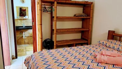Uma cama ou camas num quarto em Ondas do mar Taiba Residence