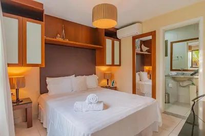Uma cama ou camas num quarto em VG Sun #109 - Apartamento em Cumbuco by Carpediem