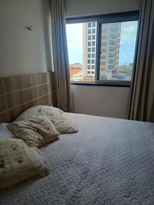 Uma cama ou camas num quarto em Apartamento praia de Iracema Fortaleza