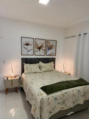 Uma cama ou camas num quarto em Casa em Fortaleza