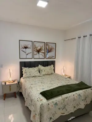 Uma cama ou camas num quarto em Casa em Fortaleza