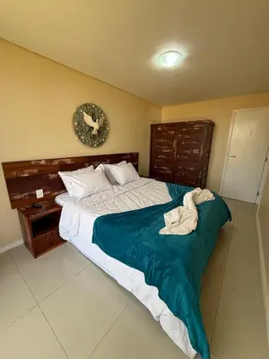 Uma cama ou camas num quarto em Varandas do Mar - Beachfront Apartment